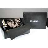 A Chanel purse, with original box.