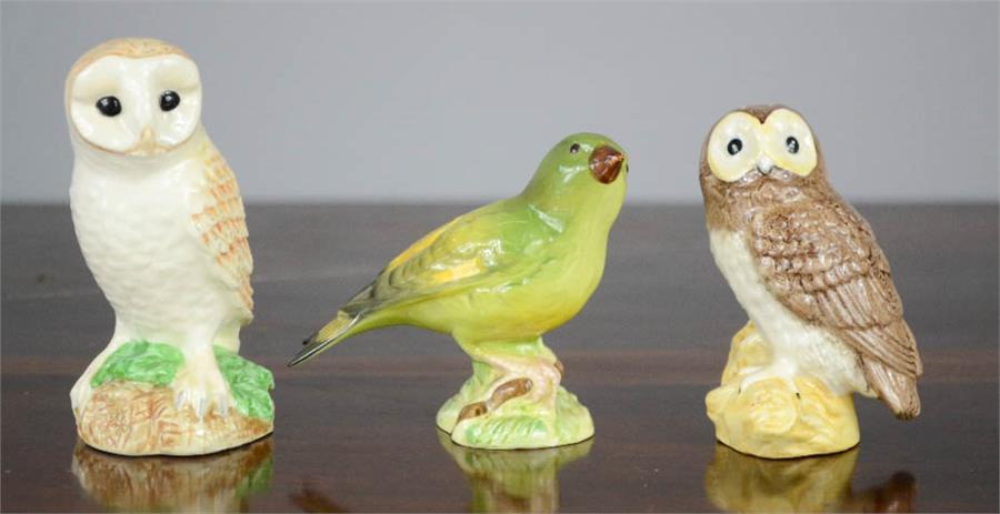 Three Beswick birds, including two owls.