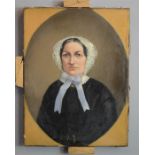 An oil on canvas, miniature female portrait.