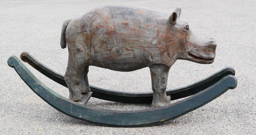 A rocking Hippopotamus, hand carved and stained.