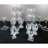 A part set of glasses to include wine, sherry and port, with chamfered sides and square bases. (16)