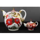 Two Russian ceramic tea pots, one small and one large depicting horses.