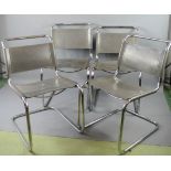 A set of four Marcel Breuer style grey leather and steel frame chairs.