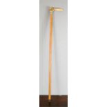 A 19th century walking cane; cricketer handle, 89cm long.