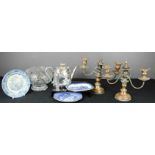 A pair of silver plated candleabra and a silver plated tea pot, crystal bowl, Willow pattern blue