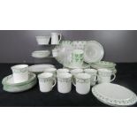 A green bordered and clover pattern set of teaware 22 pieces, and 32 pieces of green border