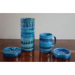 A pair of Bitossi Rimini blue ashtrays 12cm diameter, together with a Bitossi cylindrical vase