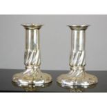 A pair of Mappin & Webb silver candlesticks with flowing ridged design, Sheffield 1891, 10.6toz.
