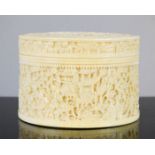 A 19th century ivory carved box, with figural scenes adorning the cover and sides.