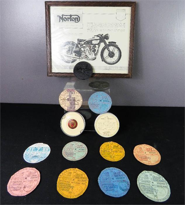A group of tax discs for Vintage motorcycles, and a Norton Model 30-40 International.