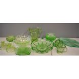 A quantity of uranium glassware to include jug, fruit bowl, dessert bowls, milk, sugar, candlesticks