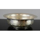 An Egyptian silver bowl engraved with decoration.