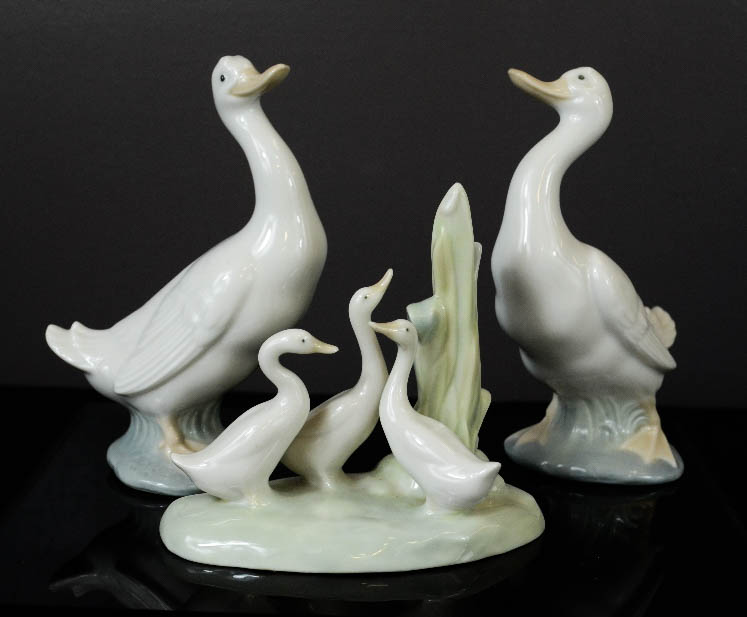 A set of three Nao Lladro ducks and ducklings.