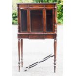 A 19th century rosewood cabinet, in the manner of Gillows, the upper section with glazed doors,