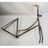 A vintage bicycle frame, with original bell.