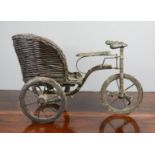 A vintage tricycle / rickshaw, with wicker back, 28cm high.