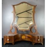 An Edwardian mahogany toilet mirror, with serpentine shaped front comprising three drawers, inlaid