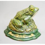 A Wright Studios cast iron hand painted doorstop in the form of a frog, with a glass eye.