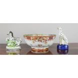 An early 19th century Chinese bowl, a 19th century Staffordshire Zebra and Dalmation.