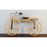 A wooden model Victorian boneshaker bicycle