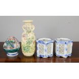 A group of Chinese ceramics including brush pot, and two ceramic candle holders, blue and white with