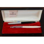 Two Parker pens, with one original box.