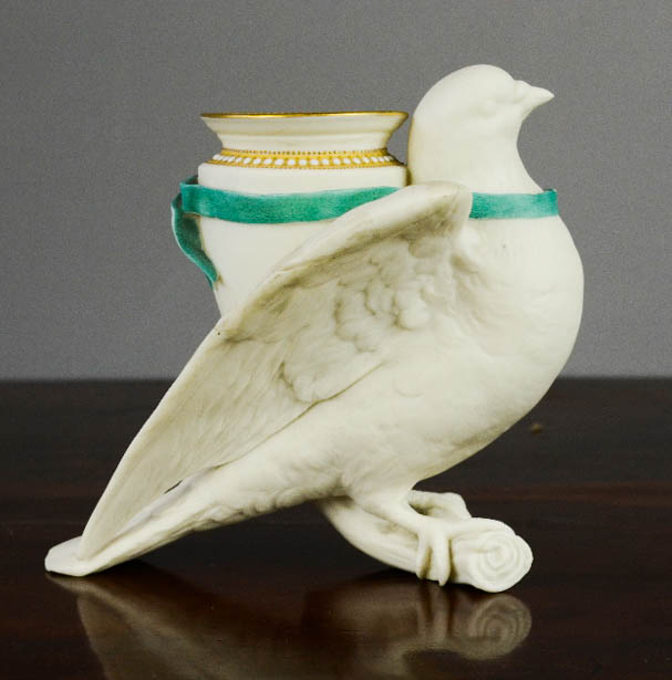 A Royal Worcester bisque vase in the form of a dove.