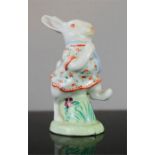 A Japanese porcelain rabbit, hand painted wearing a dress.