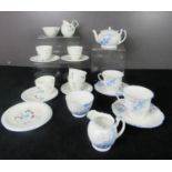 A Foley green bordered Brain & Co 1930s part tea set, Foley ware blue floral pattern 8 pieces of