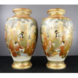 A pair of fine 19th century Satsuma vases, depicting figural scenes with detailed gilded highlights,