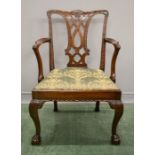 A fine Chippendale period armchair, carved and pierced splat, and upholstered drop in seat.