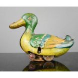 A mechanical antique tin duck.