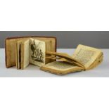 Two miniature illustrated 18th century bibles, leather bound.