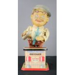 A caricature Charley Weaver Bartender, mechanical tin,