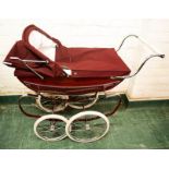 A Silver Cross burgundy child's pram, no.TS048272.