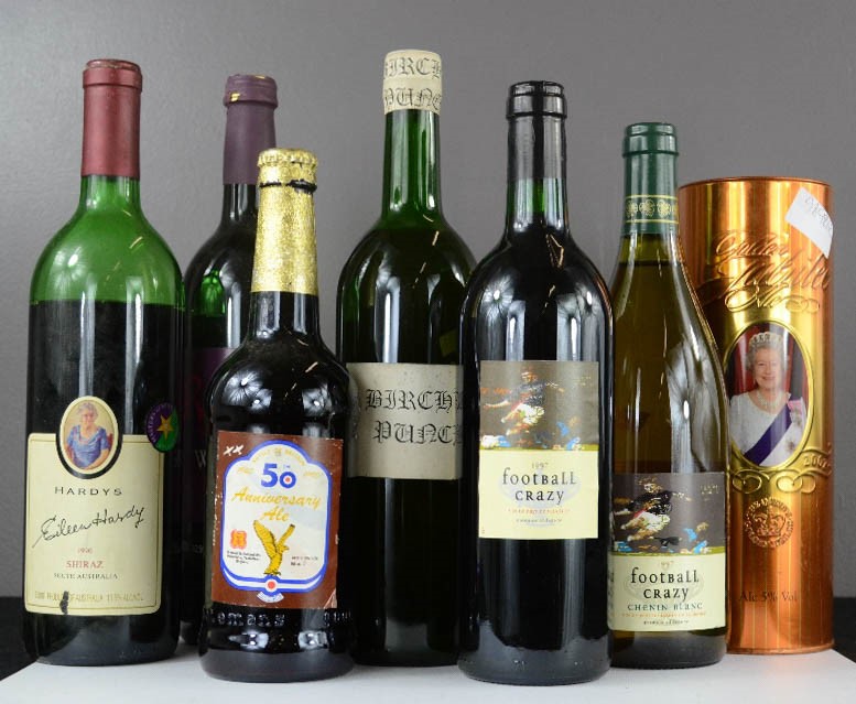 A group of wines to include Hardys, Mulled wine, Ale, and other bottles.