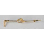 A 9ct gold and diamond tie pin, in the form of a horse and riding crop, 8.1g.