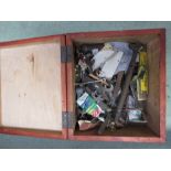 A wooden box containing tools, rules etc.