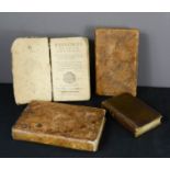 Four antique leather bound books.