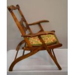 A folding Victorian chair.