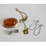 A silver and amber cabochon brooch, together with a pair of silver hoop earrings, and two flowerhead