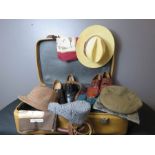 A suitcase containing gentleman's attire, leather shoes, tweed hats etc.