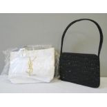 An Yves St Laurent canvas bag and a Lulu Guinness black evening bag.