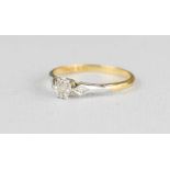 An 18ct gold and platinum solitaire diamond ring, 2g.