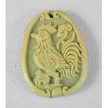 A Chinese jade carved pendant depicting a cockerel.