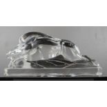 A pressed glass paperweight in the form of a warthog.