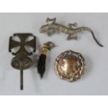 A silver and marcasite lizard brooch, a silver cruciform finial, a silver gilt brooch, and a 9ct