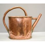 A 19th century copper watering can.