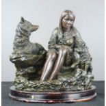 A resin case group; lady with wolves, 20cm high.