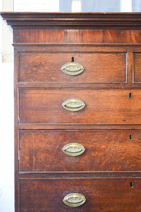 A 19th century mahogany chest on chest, with crossbanding and oval brass handles, raised on - Image 2 of 2